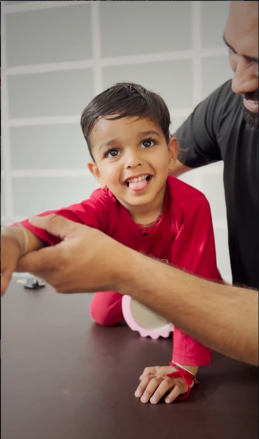 Smiling patient standing in clinic after successful rehabilitation